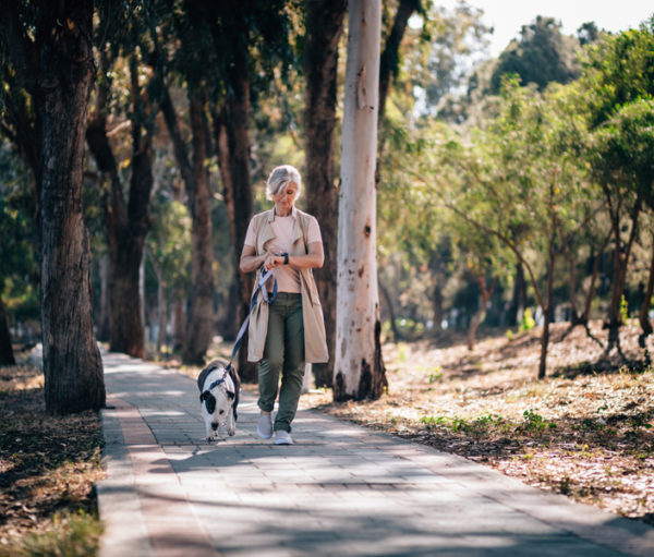 Woman walking dog