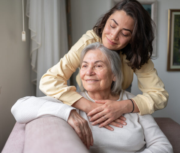 Daughter Hugging Senior Mother For Love Bonding Together